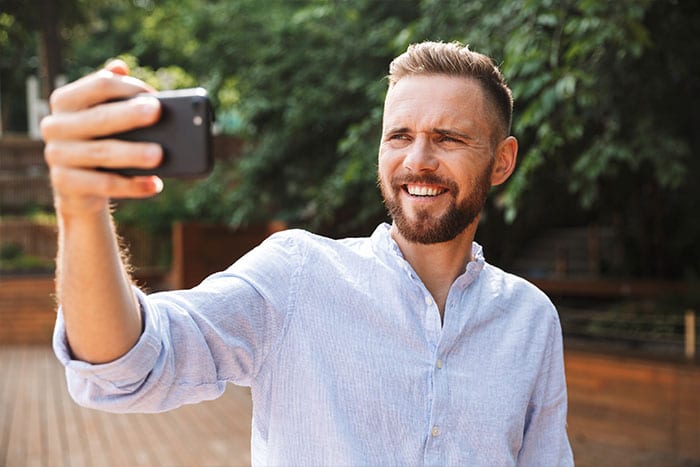 man taking selfie
